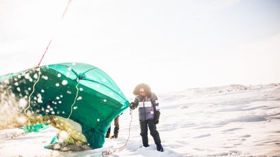 Lin holds a corner of the "Emerald Igloo," a Matty McNair-designed tent that we practiced with during a lunch stop in the first week of training.