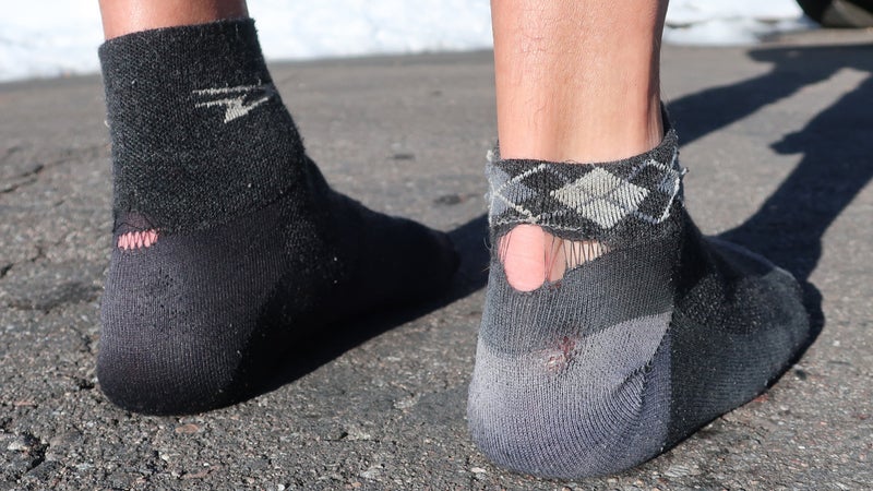 A conservative estimate for the lifespan of the Wooleator is 300 miles per pair. Under good conditions (that is, normally clean and dry), I think it's probably more like 400 to 500 miles per pair. The most common blowout point for me is at the bottom of the cuff, followed by wearing through the heel. The sock on the right is trashed; the sock on the left still has about 100 miles of life.