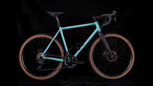 The Grimes R1 looks a bit like your father’s steel frame, but it hides all the goodies we crave: oversize head tube, 12mm thru axles front and rear, routing that accommodates Di2, disc brakes, and a threaded English bottom bracket. The bottom bracket is high enough that you could race cross, but still low enough for stability cruising dirt roads. One thing a few testers noted: the reach is fairly long, so expect a fairly stretched out position (or plan accordingly with a shorter stem).