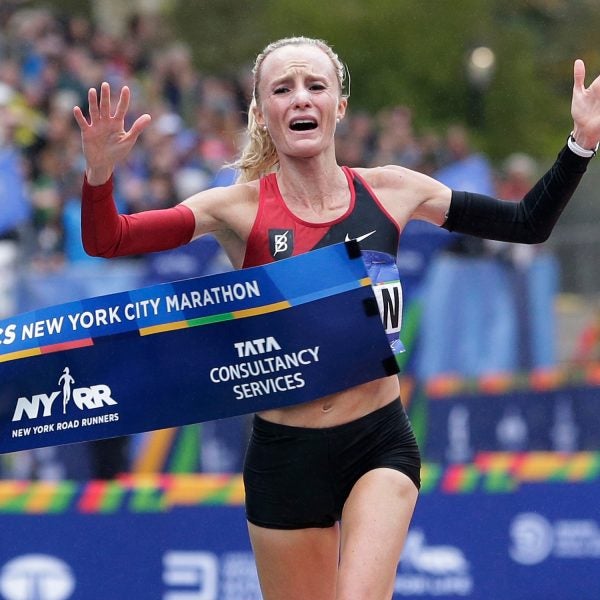 Shalane Flanagan crosses the finish line of the New York City Marathon, becoming the first American woman to win the race in 40 years.
