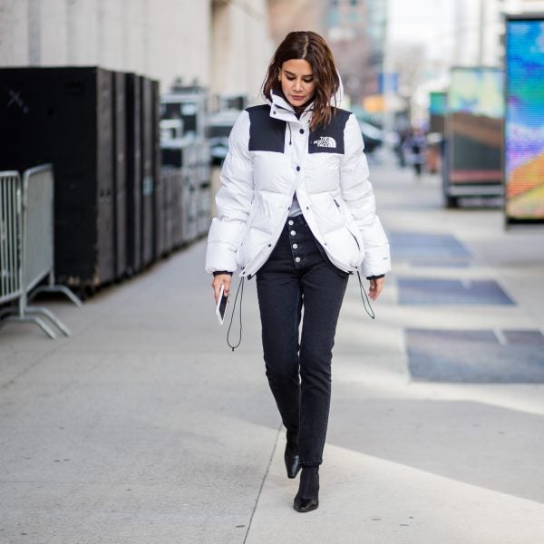 Christine Centenera wearing a white The North Face jacket seen outside Michael Kors during New York Fashion Week 2018.