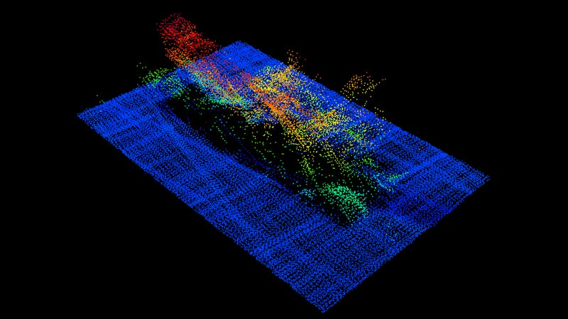 The FV Destination seen via sonar imaging resting on its port side on the seafloor. The skeg and rudder can be seen in light green below the starboard quarter on the left of this image.