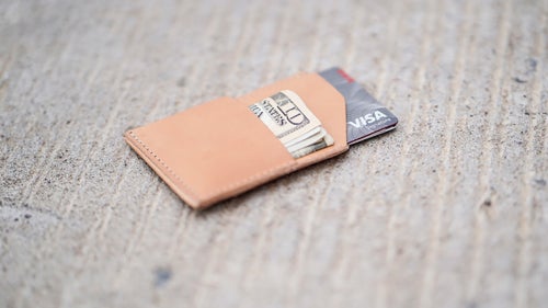 Fat wallets be gone! Thanks to just two pockets, this tiny, handmade leather pouch will only carry a couple cards and some cash, forcing you to pair down and simplify your life. It might not be for everyone, but for looking to clear out wallet clutter, it’s a God-send.
