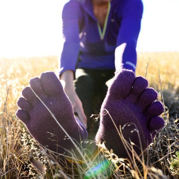 A woman runs at sunrise on the trails of Green Mountain near Denver, Colorado.