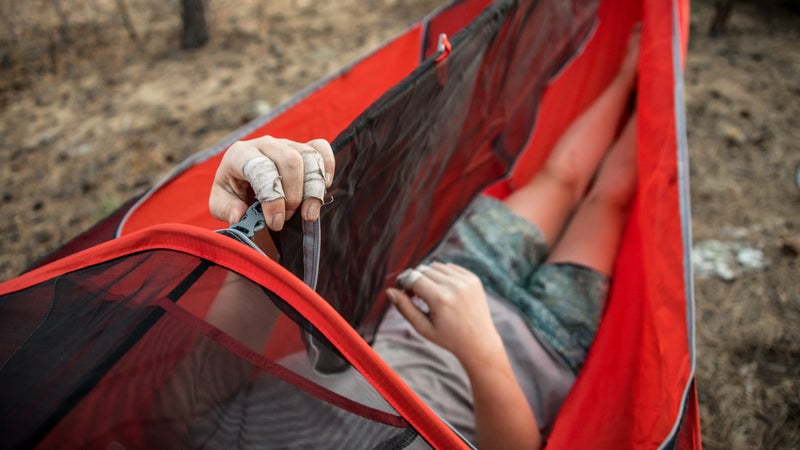 Fastening the bug-net spine buckle.