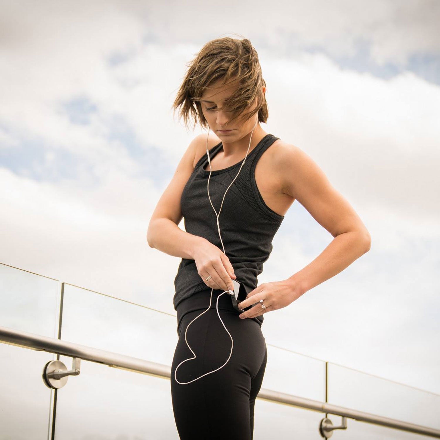 The two open-ended sheaths secure a phone and even a small wallet, and keep them from bouncing while you run.