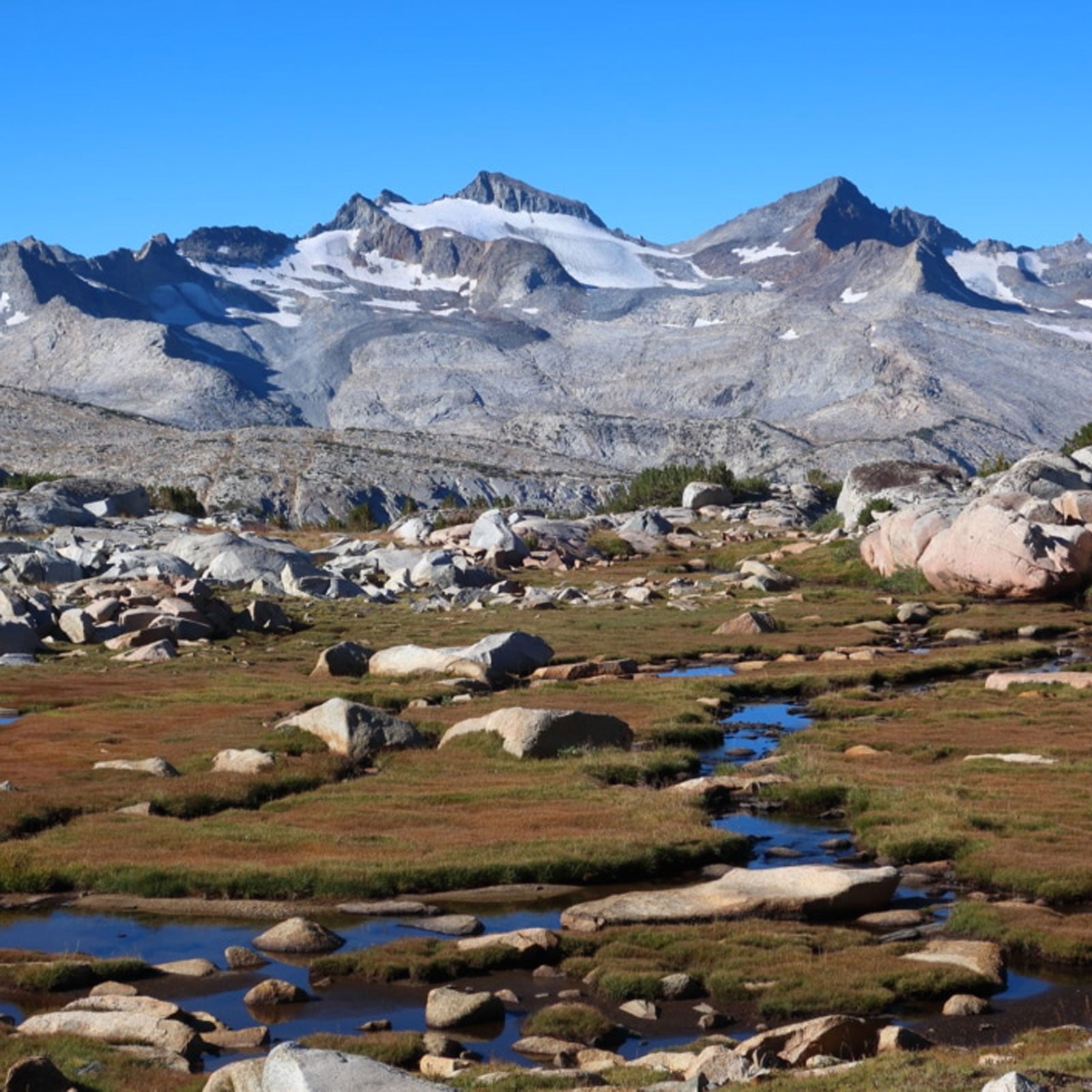 Mt. Lyell, the highest peak in Yosemite. Russell Pass, a hard Class 2 over the Cathedral Range, is the low spot on the far-right ridge, to the right of the small tower.