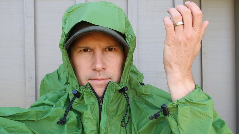 The shock cords and cord locks on the hood, bottom hem, and pack cover cinch are all excessively large and heavy. The wrist cuff adjustment should use Velcro.