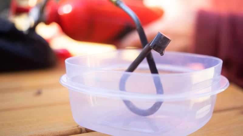 Allow a couple tablespoons to release from the fuel generator loop.