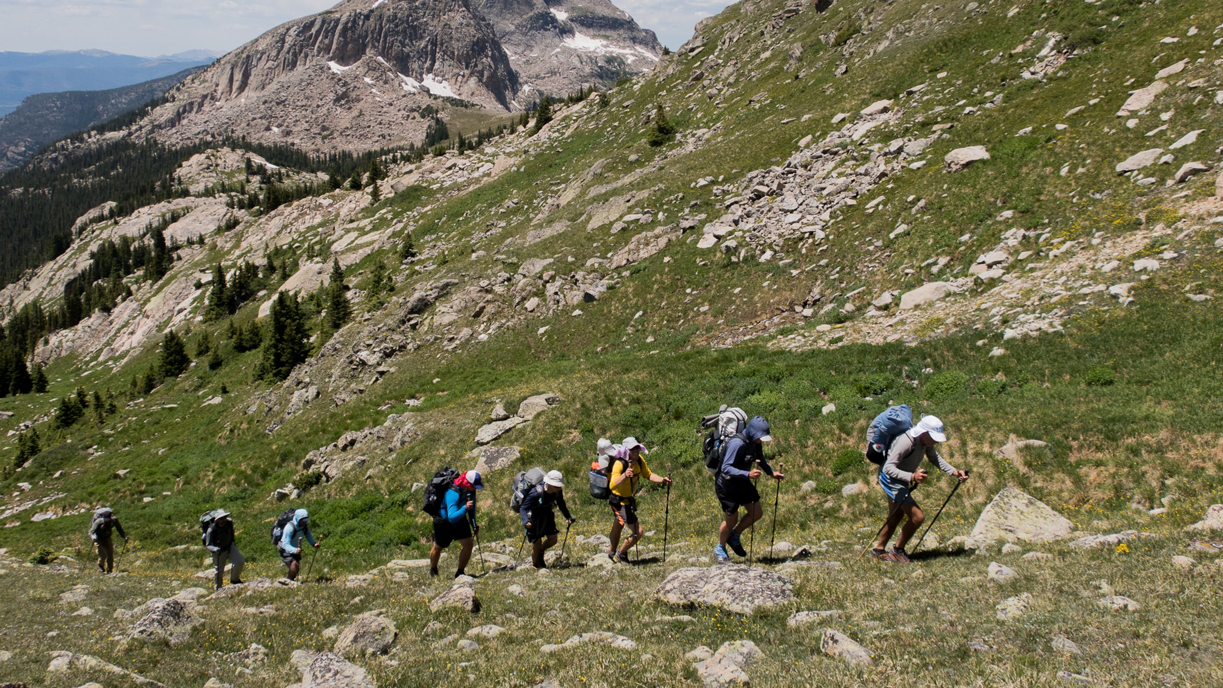 It had to be the poles. Buzz Burrell of Ultimate Direction guides a group of men half his age towards Boulder-Grand Pass in Rocky Mountain National Park.