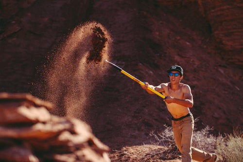 Digger Jacob Spera tosses some dirt for Remy Metallier's line.