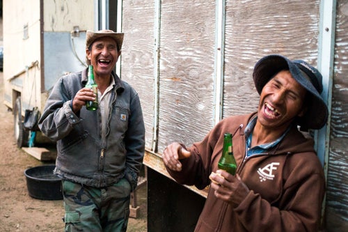Heraclio DeLaCruz, left, and Edgar Camayo share a laugh while speaking Quechua, an Incan indigenous language, in the Teanaway Community Forest near Cle Elum, Wash. Basque shepherds brought their knowledge of sheep husbandry to the American West in the early 1900s. Many of the basque herders have settled in the United States and now the workforce comes from Latin America. Almost all of the sheepherders who work for the S. Martinez operation are from Huancayo, Peru. (Sofia Jaramillo)
