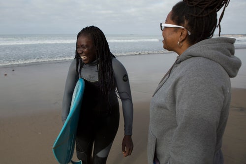 Harper has been a surf coach and competition judge for decades. Noticing a dearth of black women in the surfing community, in 2014 she founded Black Girls Surf, an organization that trains black women and girls to become professional surfers. She came across Sambe online in 2016 while looking at photos of surfers in Dakar. She noticed one woman who kept coming up in the photos and contacted local people to figure out who she was. At the time, Sambe was a surfing teacher at a camp and had dreams of going pro. The fact that Sambe was the only woman surfing in Senegal made it impossible for her to formally compete, so she was eager to travel elsewhere and connect with the world of professional female surfers.
Harper reached out to Sambe, and they were in contact for two years before Sambe finally came to the U.S. to start training, messaging every day on Facebook and Whatsapp. “Every single time we talked, Khadjou would ask when she was coming,” says Harper. When Sambe landed at the San Jose airport this past July, she and Harper met for the first time. “Both of us had these huge grins on our faces,” says Harper. “The first thing I thought was, ‘This is my sister right here.’”