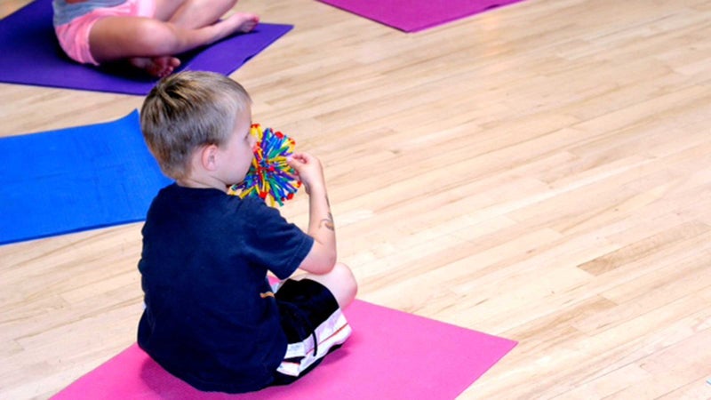 Yoga Calm's breath ball exercise teaches kids deep breathing.