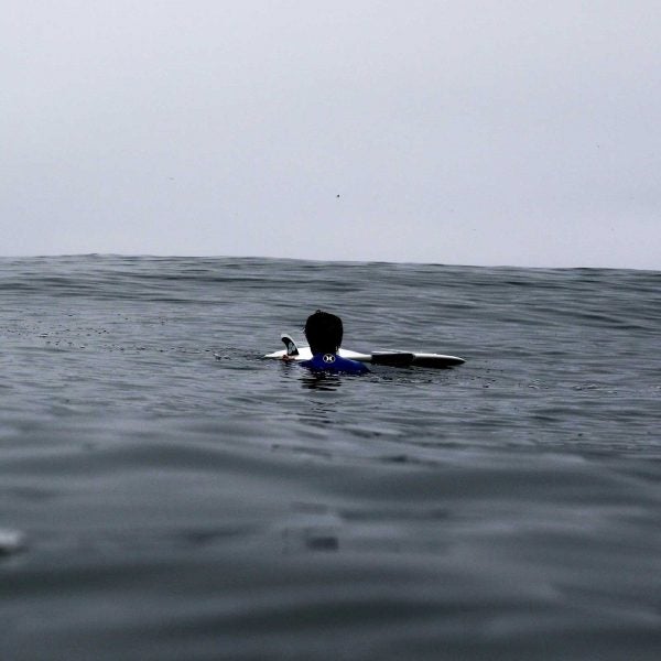 With no shore in sight, the only thing Matthew Bryce had to cling to was his surfboard and the hope that someone would find him.