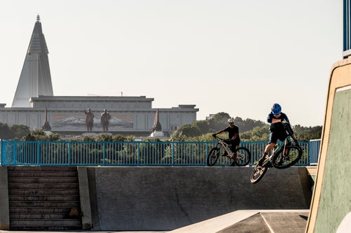 The two 66 ft high statues of former leaders Kim Il-Sung and Kim Jong-Il look on from across the city as Max Schumann rides Pyongyang’s skate park. Riding the skate park was never in our original tour itinerary, but after spotting it from our tour bus as we drove through Pyongyang we asked to ride it and our tour guides were happy to make arrangements to make it happen.