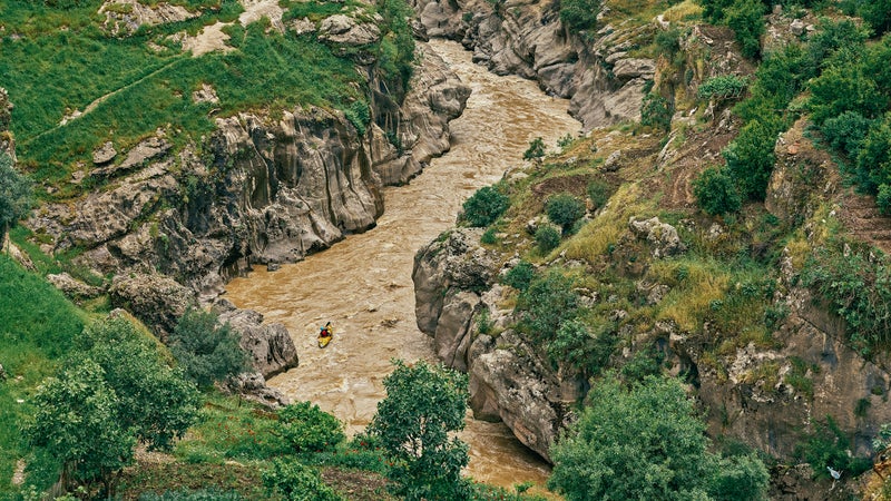 Environmental activist Nabil Musa runs a tributary of Iraq’s Rawanduz River.
