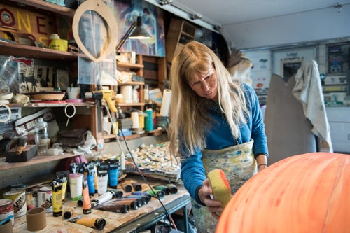 At 13, Cher Pendarvis caught her first wave on a wooden paddle board she politely borrowed from a lifeguard. Today, fifty-some years later, she is a revered pioneer of women’s surfing. Cher and her husband Steve are the team behind Pendo and Pendoflex Surfboards in San Diego, California. A triple threat in the studio as a shaper, artist, and glasser, Cher didn’t set out to push boundaries. Her love and skill for surfing were so profound that the boundaries changed around her. She became the first female team rider and shaper for Channin Surfboards, the first female staff member for Surfing Magazine, as an Art Associate. Pendarvis continues to contribute to various outlets, has published several books, and is an award winning artist. She works in her studio painting a recently shaped board with colors inspired by nature. “Every moment is precious. I am grateful for the life we live with the ocean and the work we're blessed to do. It is pure joy to make boards by hand to be ridden on the waves