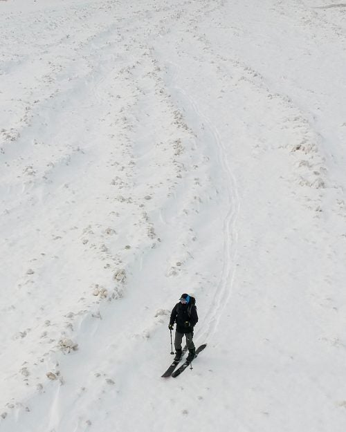 He navigates the channels of 63rd Street Beach, covered in ice ball formations that were pushed in from Lake Michigan.
