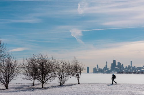 Ozner makes his way around Montrose Beach on the north side with a view of the skyline.