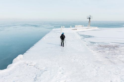 Ozner explores the frozen pier at 31st Street Beach, where there’s still some open water here despite the frigid air temps. The water sits at about 33 degrees.