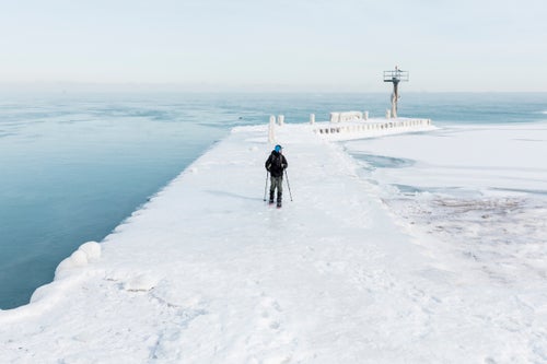Ozner explores the frozen pier at 31st Street Beach, where there’s still some open water here despite the frigid air temps. The water sits at about 33 degrees.
