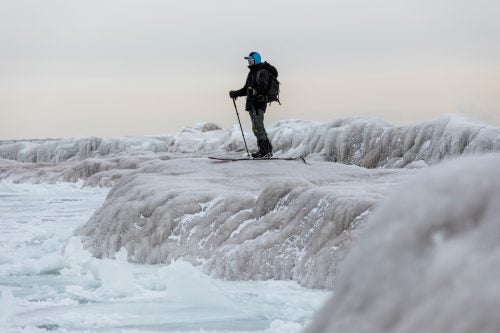 Ozner takes a closer look at the incoming ice on the lake at 63rd Street Beach before continuing south along the frozen lake.