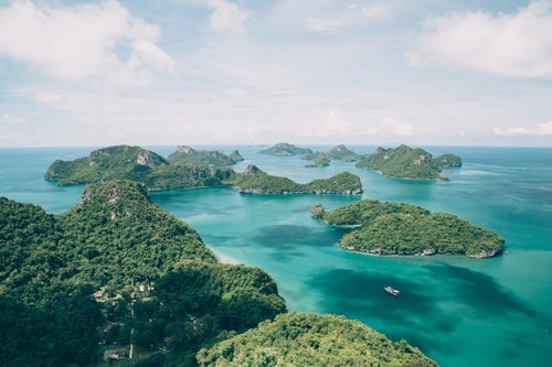 A gorgeous archipelago of 42 islands makes up Thailand’s Ang Thong National Marine Park, which is home to unique features like steep limestone formations, caves, lakes, and even sinkholes. Save for two—Ko Wua Ta Lap and Ko Phaluai—the islands are uninhabited.