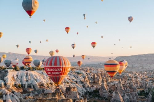 If you follow enough travel-focused Instagram accounts, you’ve probably experienced the digital awe of the hot air balloons in Cappadocia, Turkey. To see them in person, however, is to be dropped straight into a fairytale.
