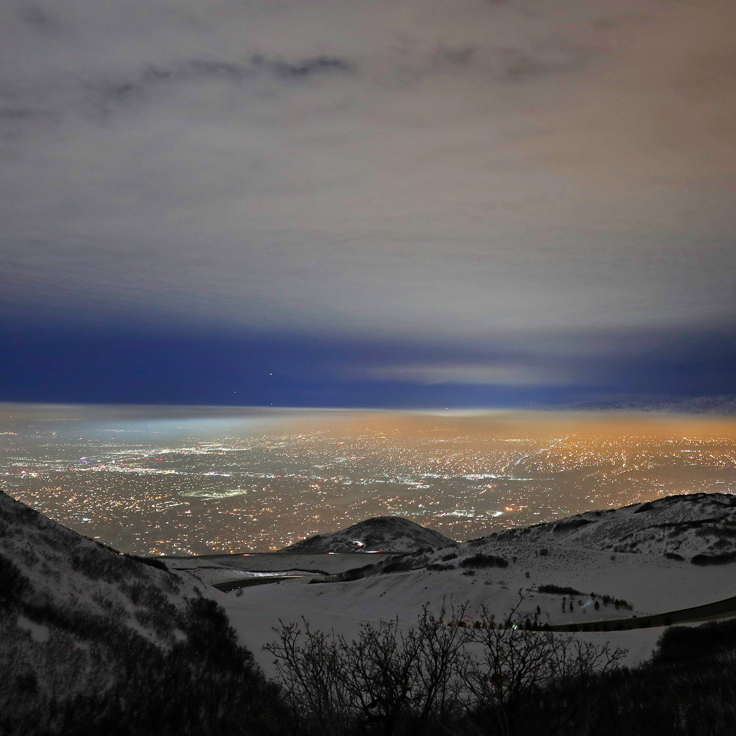 A temperature inversion traps and fills the Salt Lake Valley with thick smog.