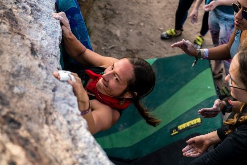 Erynne M. Gilpin, founder of @indigenouswomxnclimb, channels laser focus at the Happy Boulders.