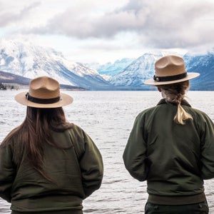 Two rangers at McDonald Lake in Glacier National Park