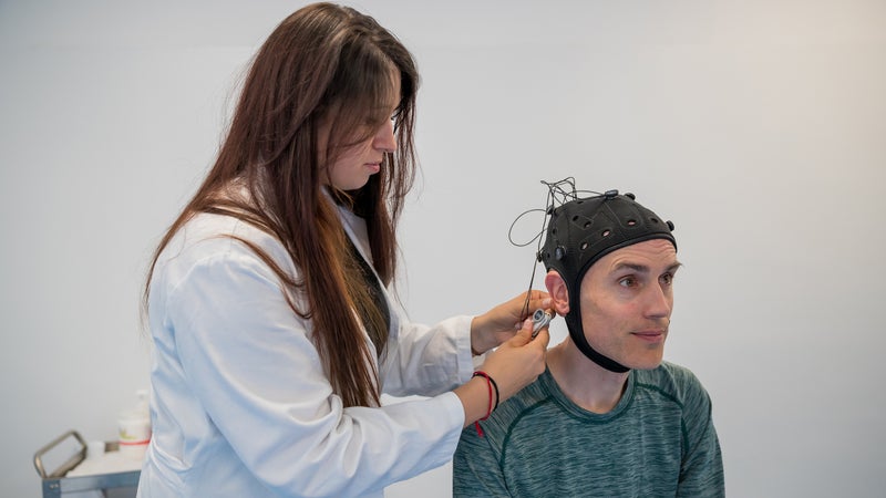 Neuropsychologist Elena Fontana, from the RIBA Rehabilitation Institute, wires up the author for a session of transcranial direct-current stimulation (tDCS) after a long day of riding.