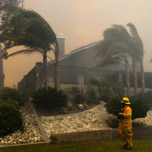 The Santa Ana winds drove a wildfire close to homes in 2014.