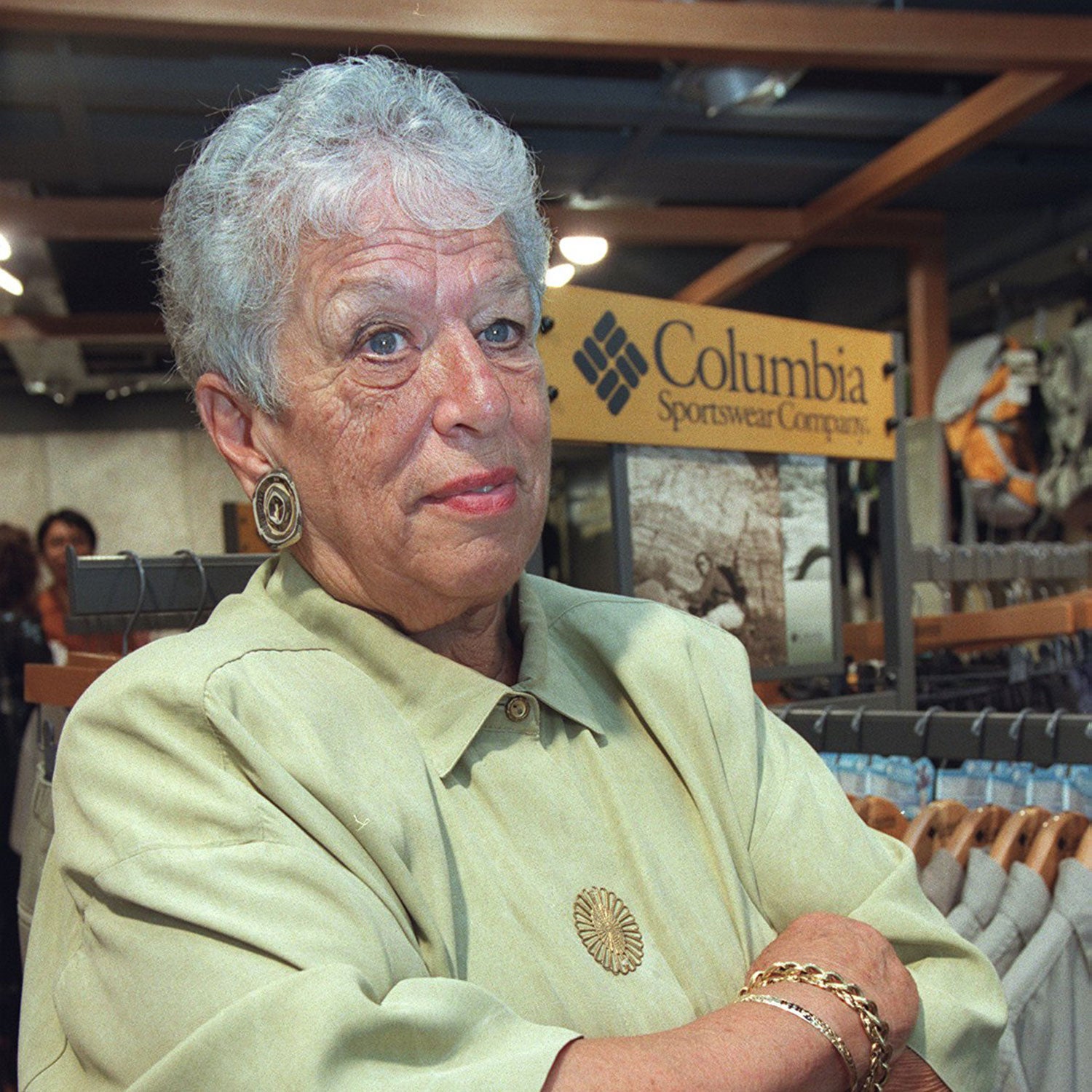 Gert Boyle poses in front of Columbia Sportswear's products in 2002.