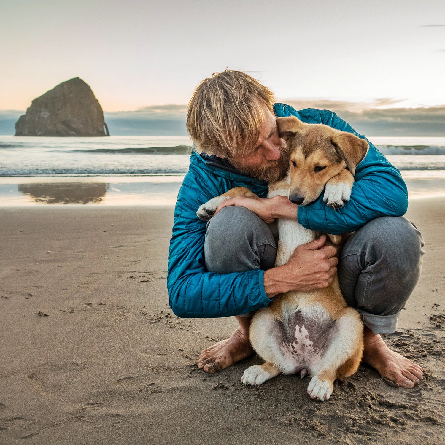 Ben Moon and his new dog, Nori, bond on the beach where the author and Denali spent Denali's final days.