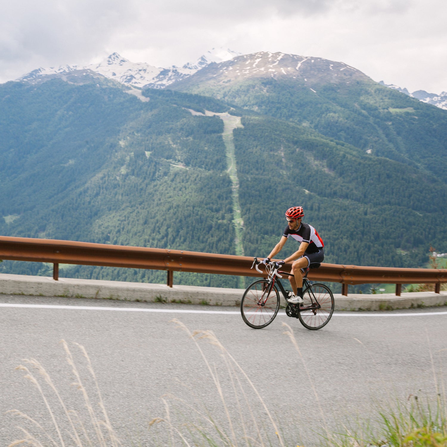 Cyclist On A Mountain Road