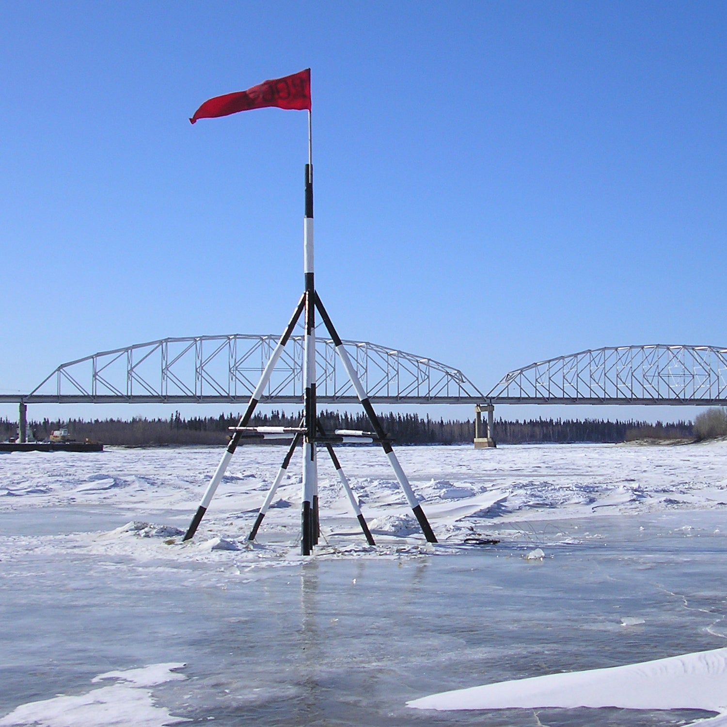 The tripod is always 26 feet tall and made of spruce. It’s always planted in the same spot. And the tripod is hooked up to clock at the end of a 100-foot length of rope.