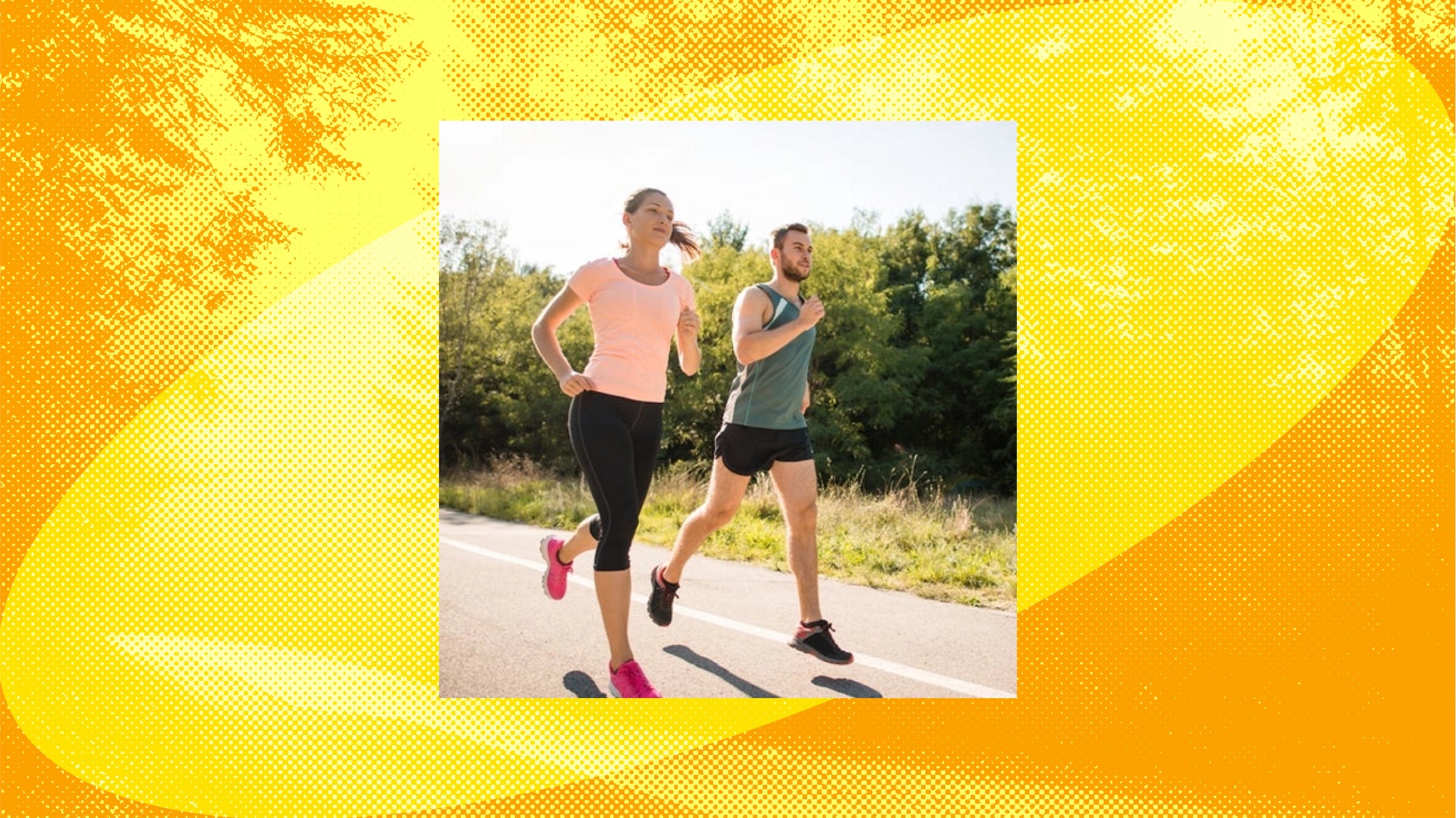 A man and woman run together on a road in the sun