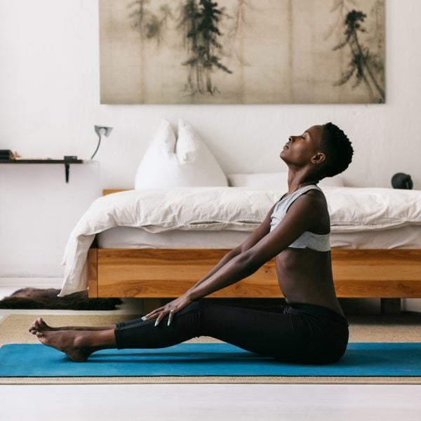 Pretty Black Woman Doing Yoga In Beautiful Home