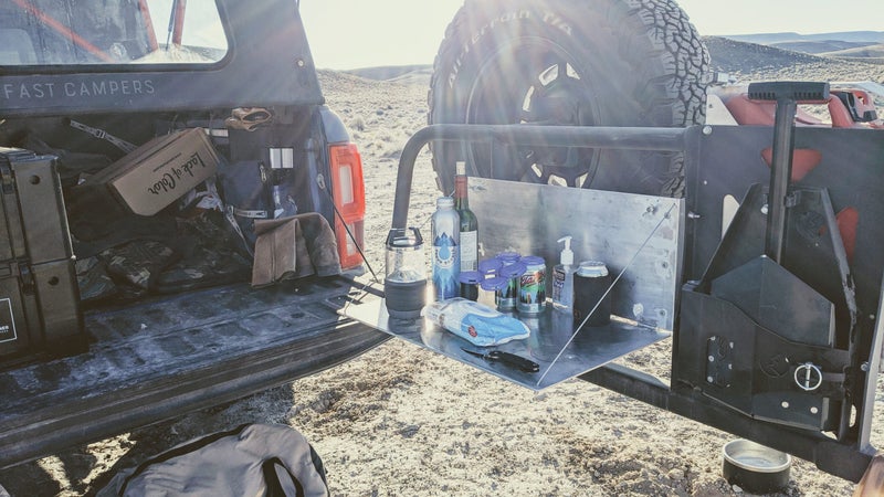 The reality of camping isn’t often perfectly curated, immaculate campsites. Arrive at night, in the cold, and you’ll typically end up with a scene like this one. The table kept important items out of the way, in a stable, safe place, even in the dark.