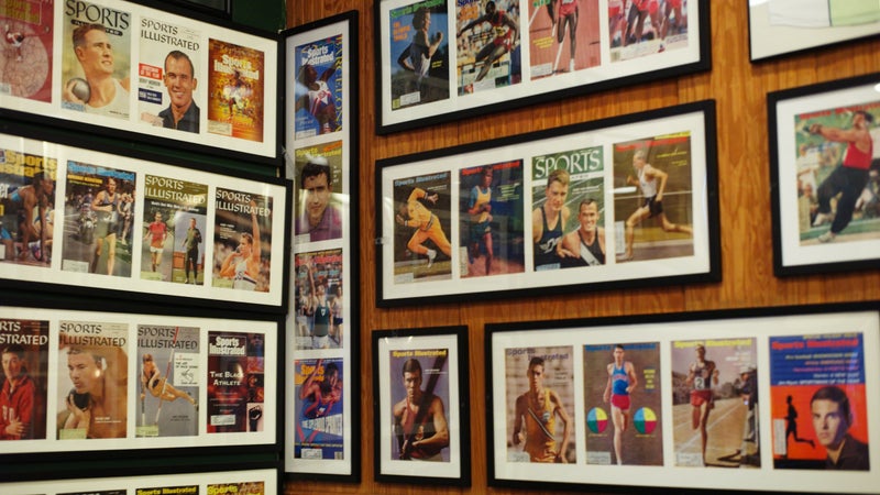 A wall inside Coogan’s, displaying Sports Illustrated covers of track and field athletes.