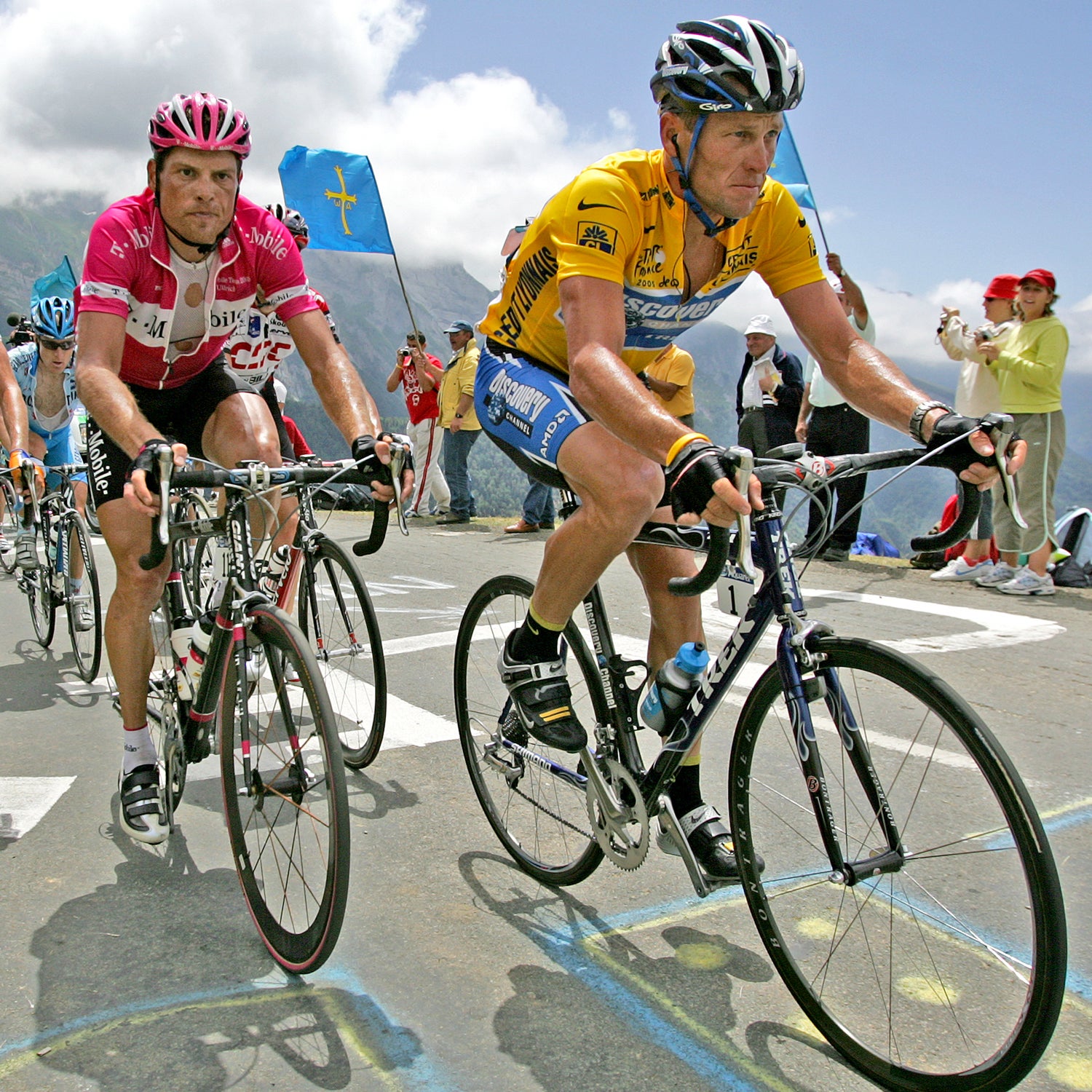 Jan Ullrich (in the pink jersey) and Lance Armstrong riding up a mountain during the 2005 Tour de France