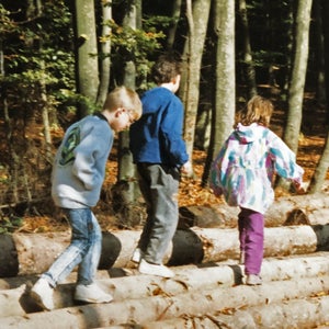 Martin Fritz Huber (left) as a seven-year-old, walking with friends during a volksmarch in Germany.