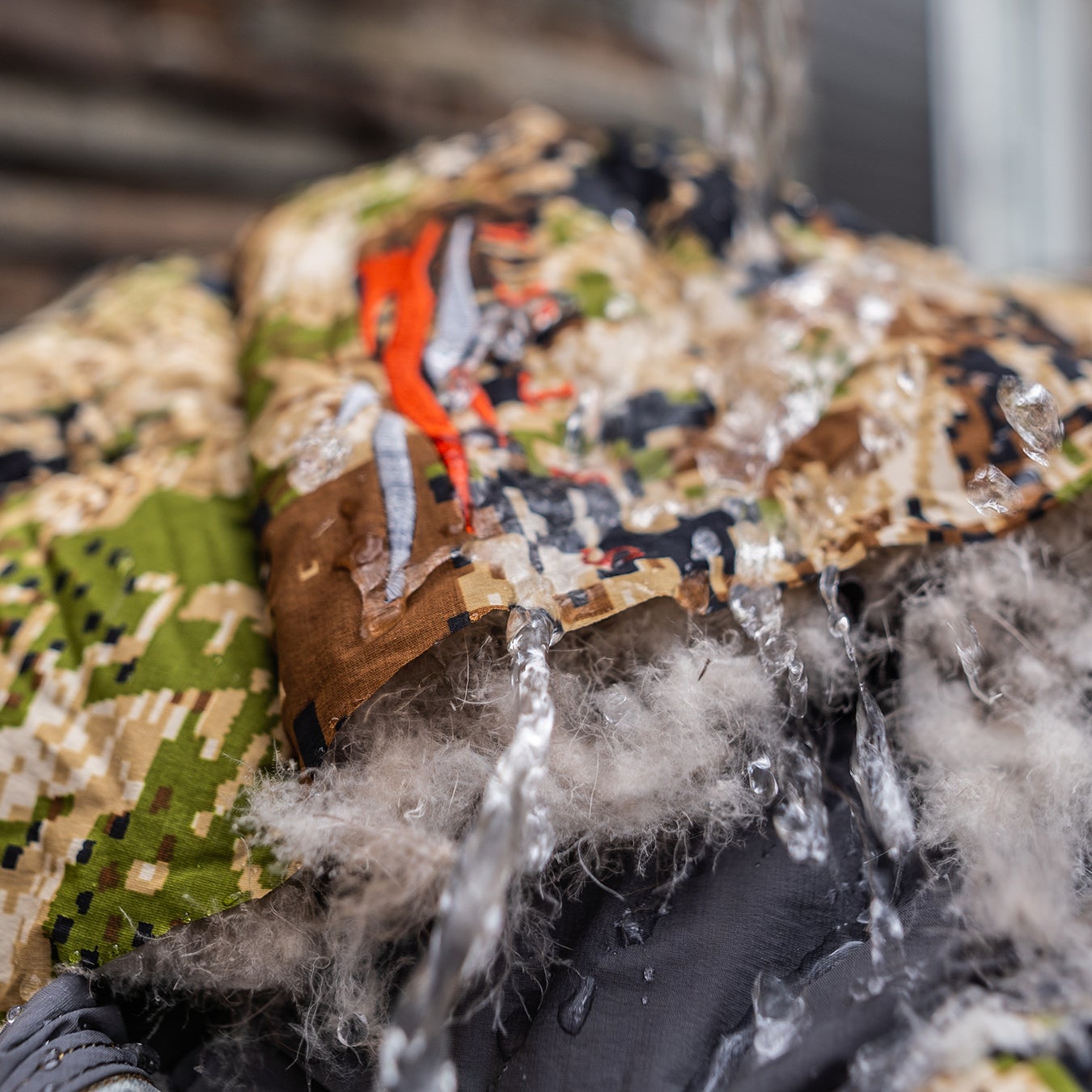 I cut up the jacket so I could see in the insulation inside—and then saturated it with water. Immediately after, it was dry to the touch, and there were no changes to its loft.