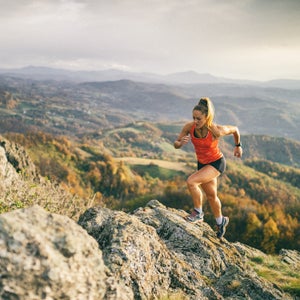 Young woman running on mountain