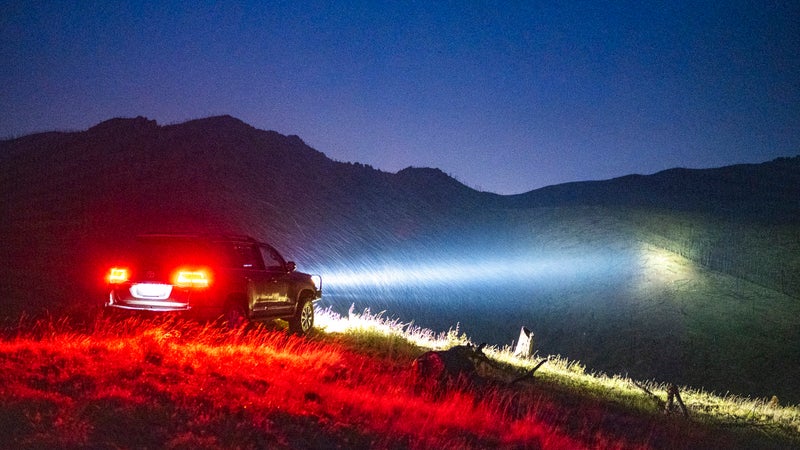 This is a neat photo because it demonstrates the performance of different color temperatures in precipitation. It's raining here, and those water droplets are refracting the blue wavelengths in the light beams, making those visible. But, you can still see that the longer, warmer wavelengths are able to carry through the rain, and still illuminate the hillside in the distance. Away from the tricks of a camera lens, driving behind the HTX2s when it's raining simply results in clear vision.