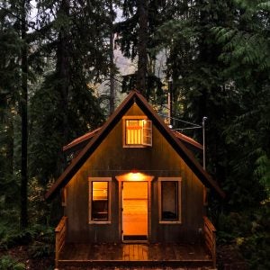 It sounds like a fantasy: join forces with a good friend to build a sweet little cabin in the woods.