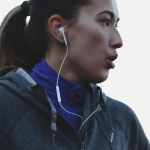 Young, Healthy Caucasian Woman Breathing Hard Outside During Running Workout