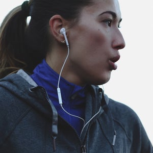 Young, Healthy Caucasian Woman Breathing Hard Outside During Running Workout